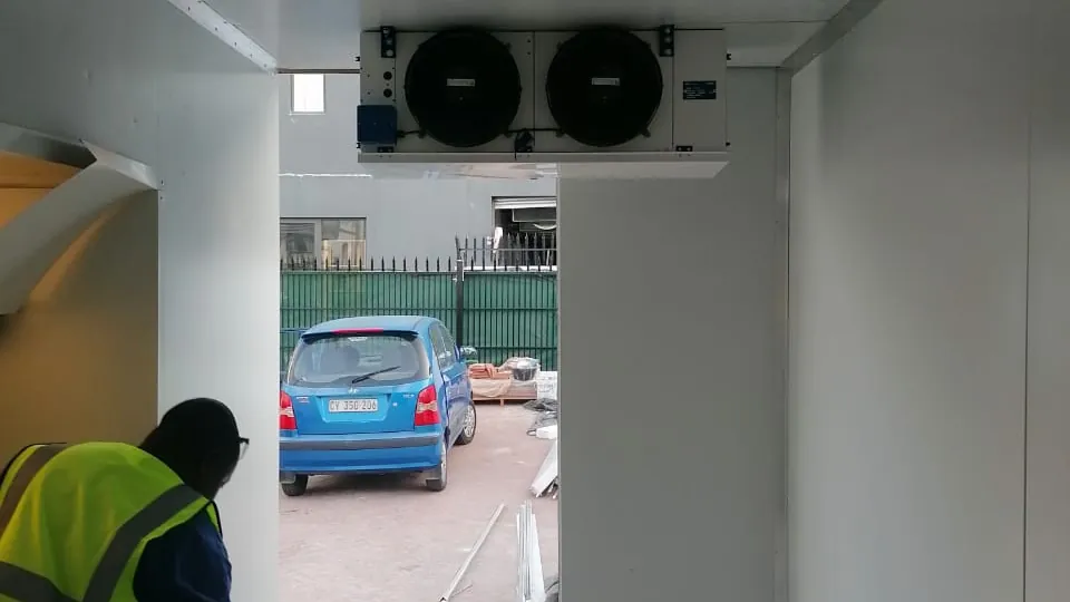 Cold room installation with evaporator unit and technician setup in Cape Town
