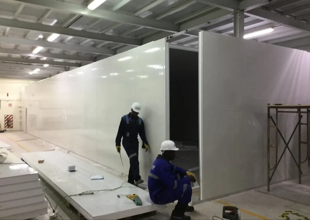 Technicians installing insulated cold room panels in a commercial refrigeration facility Cape Town